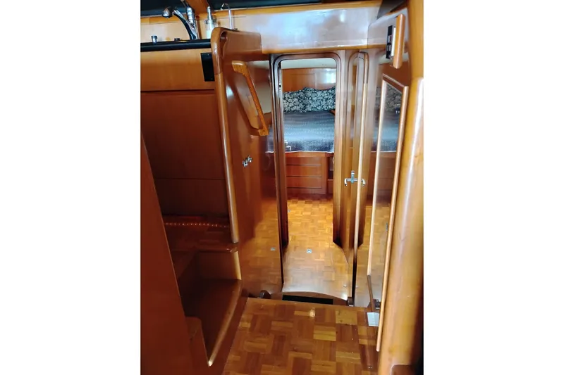 Slide: The Image of Interior view of 2004 Ocean Alexander 42 Altus yacht with wooden finishes. - 20