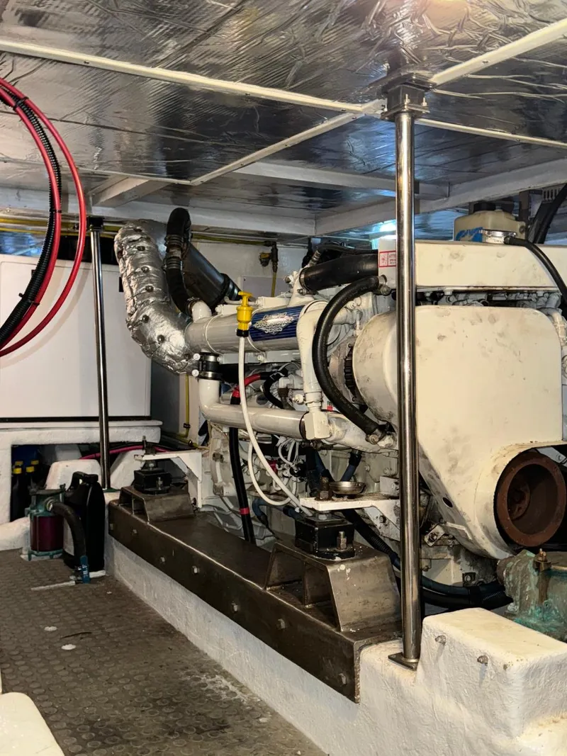 Slide: The Image of Engine room of 2004 Ocean Alexander 42 yacht, showcasing machinery and components. - 32