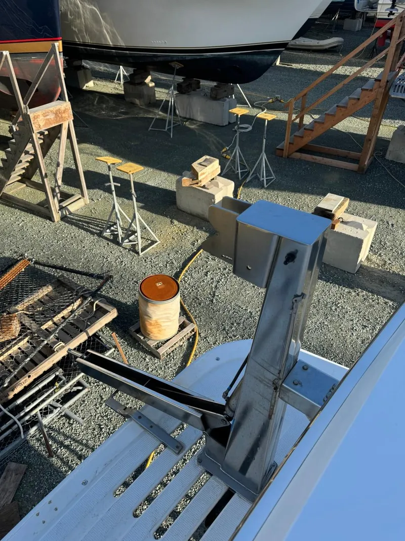 Slide: The Image of 2004 Ocean Alexander 42 yacht on dry dock with metal equipment and maintenance tools. - 35