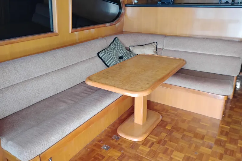 Slide: The Image of Luxurious interior of 2004 Ocean Alexander 42 Altus yacht with cozy seating and wooden table. - 5