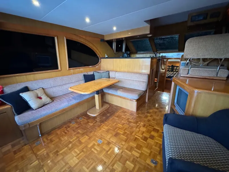 Slide: The Image of Luxurious interior of 2004 Ocean Alexander 42 yacht with elegant seating and wooden finishes. - 9