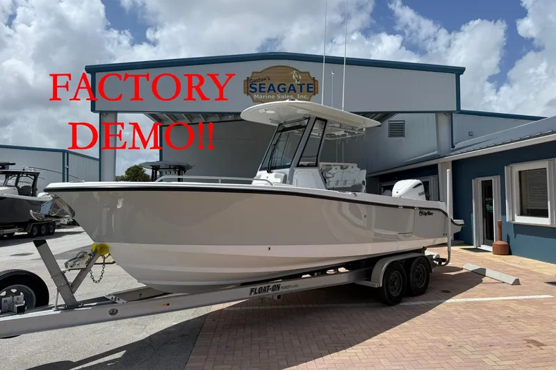The Image of 2026 Edgewater 250CC boat on trailer, labeled "Factory Demo" at Seagate Marine Sales. - 0