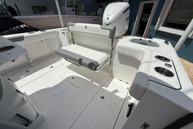 Slide: The Image of 2026 Edgewater 250CC boat interior with seating and Yamaha engine. - 10