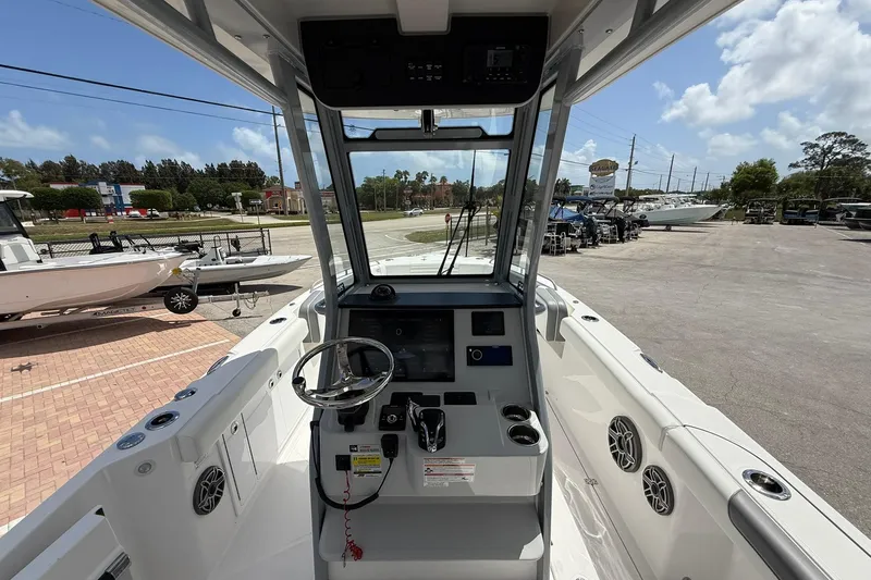 Slide: The Image of Edgewater 250CC 2026 boat cockpit with steering wheel and control panel. - 11