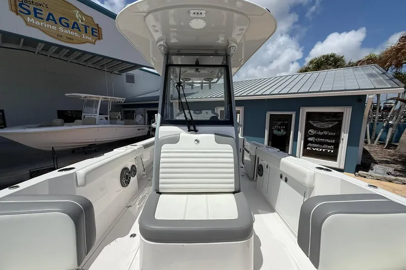 Slide: The Image of 2026 Edgewater 250CC boat at Seagate Marine Sales, featuring sleek seating and modern design. - 16