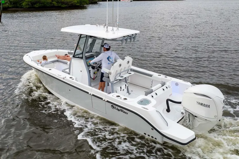 Slide: The Image of Manufacturer Provided Image: 2026 Edgewater 250CC boat cruising on water with Yamaha engine. - 17