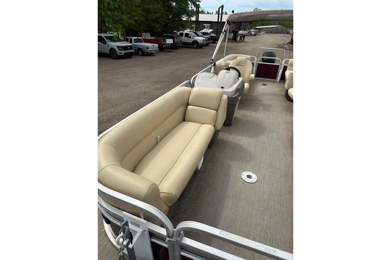 Slide: The Image of 2018 Princecraft Vectra 23 XT pontoon boat with beige seating and spacious deck. - 11