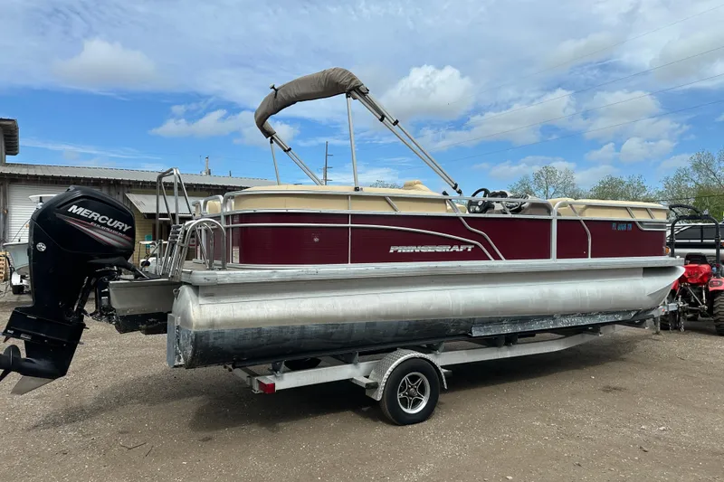 Slide: The Image of 2018 Princecraft Vectra 23 XT pontoon boat with Mercury outboard motor on trailer. - 2