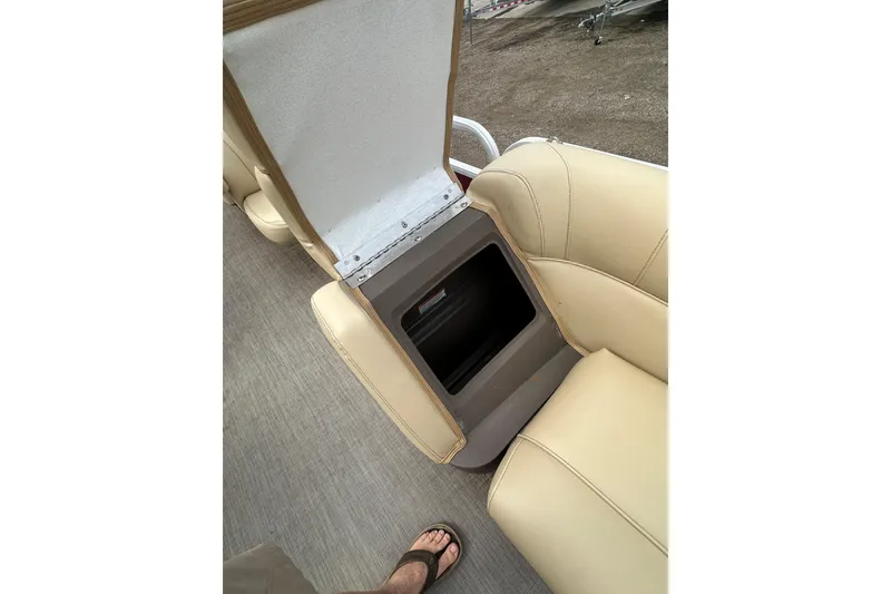 Slide: The Image of 2018 Princecraft Vectra 23 XT boat seat storage compartment open, revealing interior space. - 21