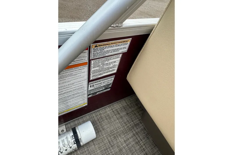 Slide: The Image of 2018 Princecraft Vectra 23 XT boat warning labels and capacity information. - 24