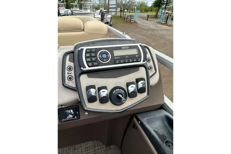 Slide: The Image of Control panel of 2018 Princecraft Vectra 23 XT boat with radio and switches. - 25