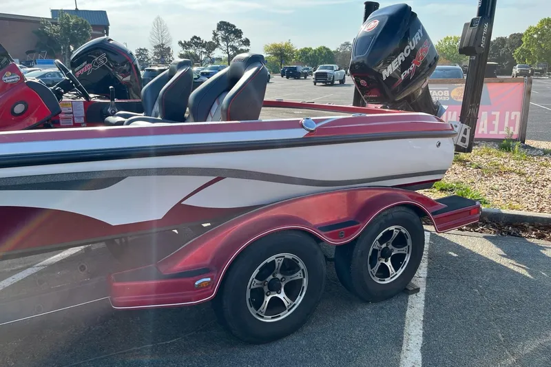 Slide: The Image of 2018 Nitro Z21 boat on trailer with Mercury Pro XS engine in parking lot. - 2