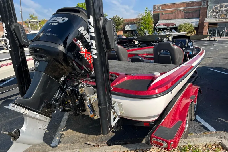 Slide: The Image of 2018 Nitro Z21 boat with Mercury 250 Pro XS engine in a parking lot. - 3