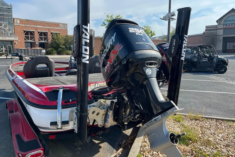 Slide: The Image of 2018 Nitro Z21 boat with Mercury Pro XS engine in a parking lot. - 4