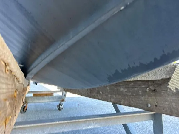Slide: The Image of Underside of a 2014 Chaparral 244 Sunesta boat on a trailer. - 15