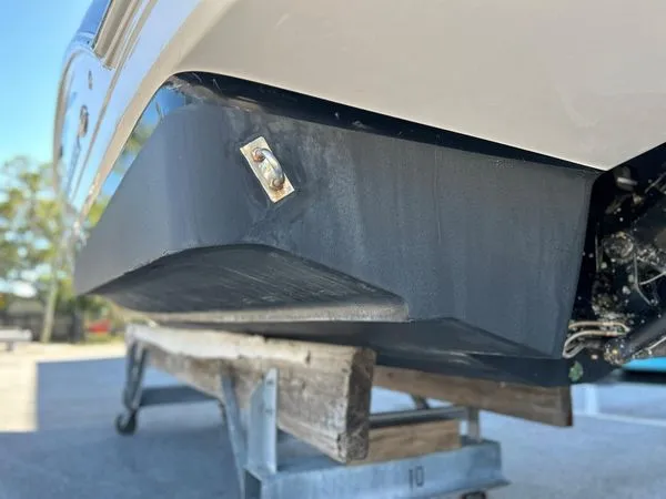 Slide: The Image of Close-up of the hull of a 2014 Chaparral 244 Sunesta boat. - 16