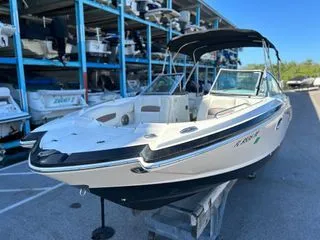 Slide: The Image of 2014 Chaparral 244 Sunesta boat on storage rack. - 2