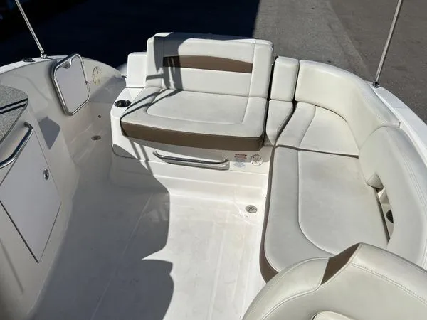 Slide: The Image of 2014 Chaparral 244 Sunesta interior with white seating. - 27