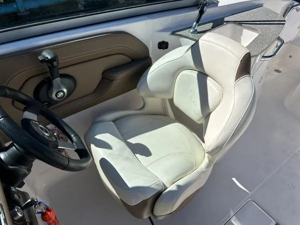 Slide: The Image of Interior of a 2014 Chaparral 244 Sunesta boat with helm seat. - 29