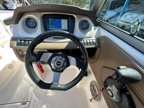 Slide: The Image of Cockpit of a 2014 Chaparral 244 Sunesta boat with navigation system. - 30