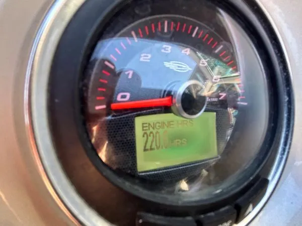 Slide: The Image of Chaparral 244 Sunesta 2014 tachometer showing 220 engine hours. - 33
