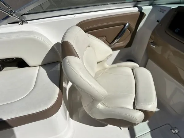 Slide: The Image of Interior of 2014 Chaparral 244 Sunesta boat with beige seating. - 36