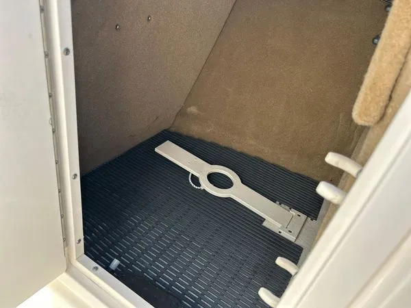 Slide: The Image of Interior of 2014 Chaparral 244 Sunesta boat, storage compartment view. - 38