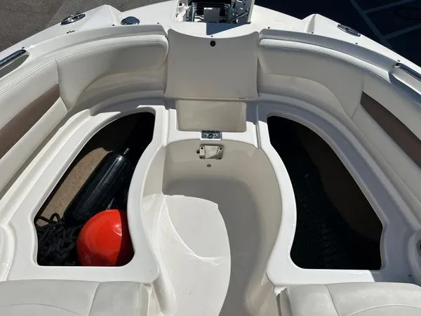 Slide: The Image of Interior of 2014 Chaparral 244 Sunesta boat with storage compartments. - 40