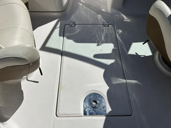 Slide: The Image of Interior of 2014 Chaparral 244 Sunesta with storage hatch. - 42