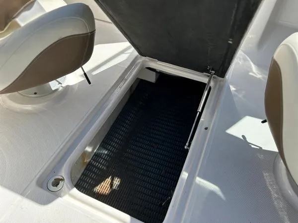 Slide: The Image of Storage compartment in 2014 Chaparral 244 Sunesta boat. - 43