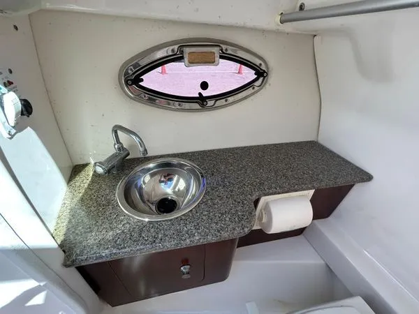 Slide: The Image of Interior of 2014 Chaparral 244 Sunesta with sink and window. - 47
