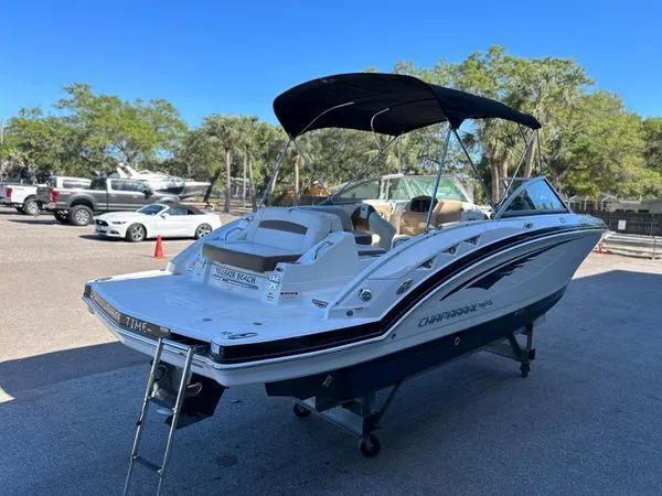 Slide: The Image of 2014 Chaparral 244 Sunesta boat with black canopy on trailer. - 9