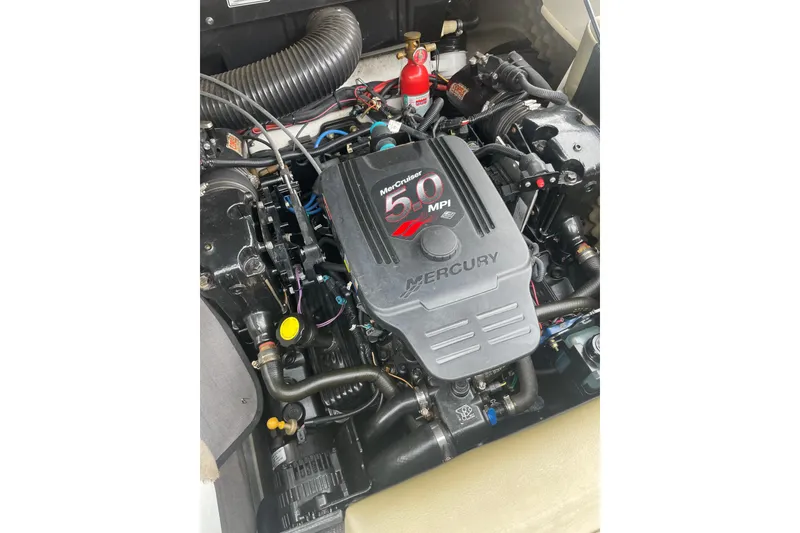 Slide: The Image of Engine of a 2007 Sea Ray 220 Select boat, featuring a Mercury 5.0 MPI motor. - 15