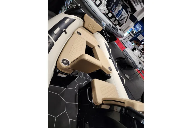 Slide: The Image of 2026 Highfield Sport 520 boat interior with beige seating and modern design. - 10
