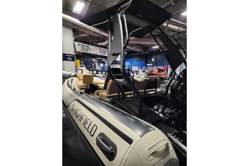 Slide: The Image of 2026 Highfield Sport 520 boat displayed indoors, showcasing sleek design and modern features. - 12