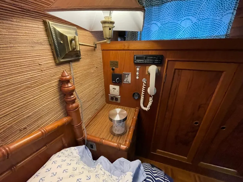 Slide: The Image of Interior of 1972 Grand Banks Alaskan 55 yacht with vintage phone and wooden paneling. - 20