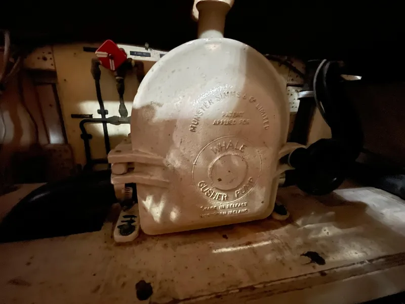 Slide: The Image of Engine room component of 1972 Grand Banks Alaskan 55 boat, featuring a vintage mechanical part. - 37