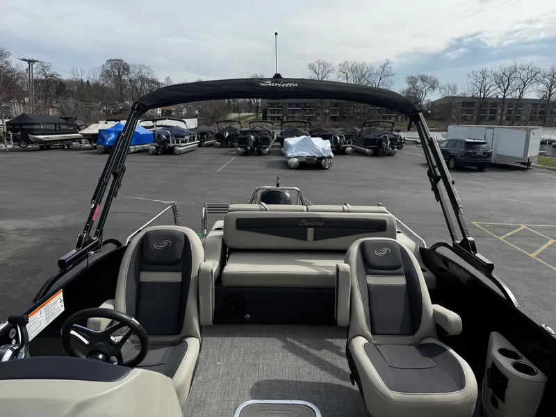 Slide: The Image of Interior view of a 2022 Barletta C22UC pontoon boat in a parking lot. - 10