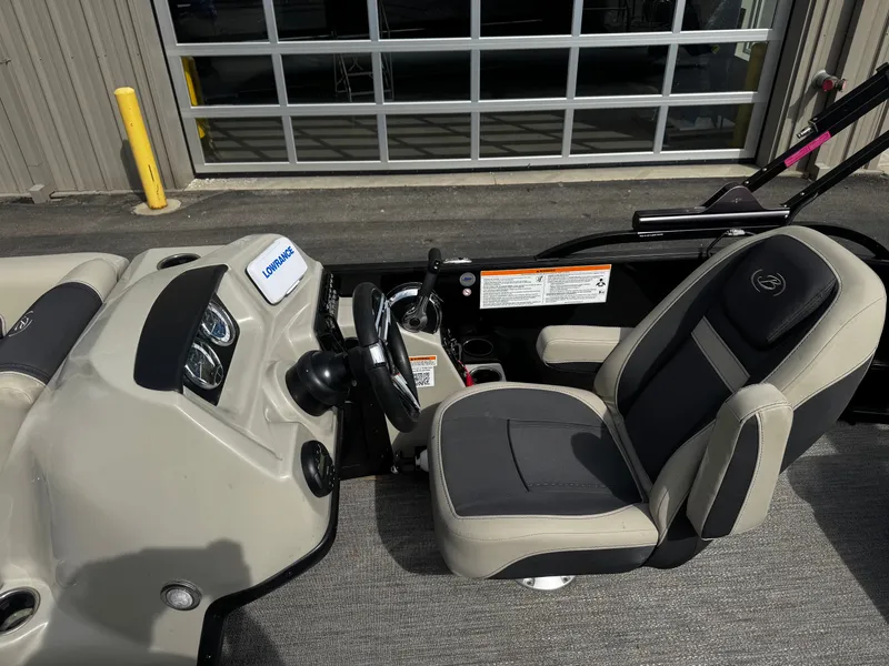 Slide: The Image of Interior of a 2022 Barletta C22UC boat with steering console. - 11