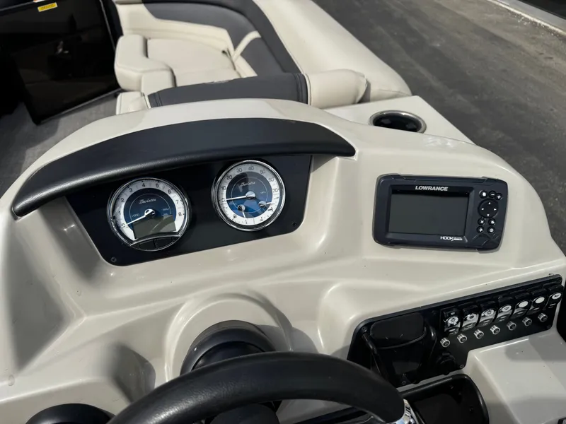 Slide: The Image of Dashboard of a 2022 Barletta C22UC with gauges and Lowrance device. - 12