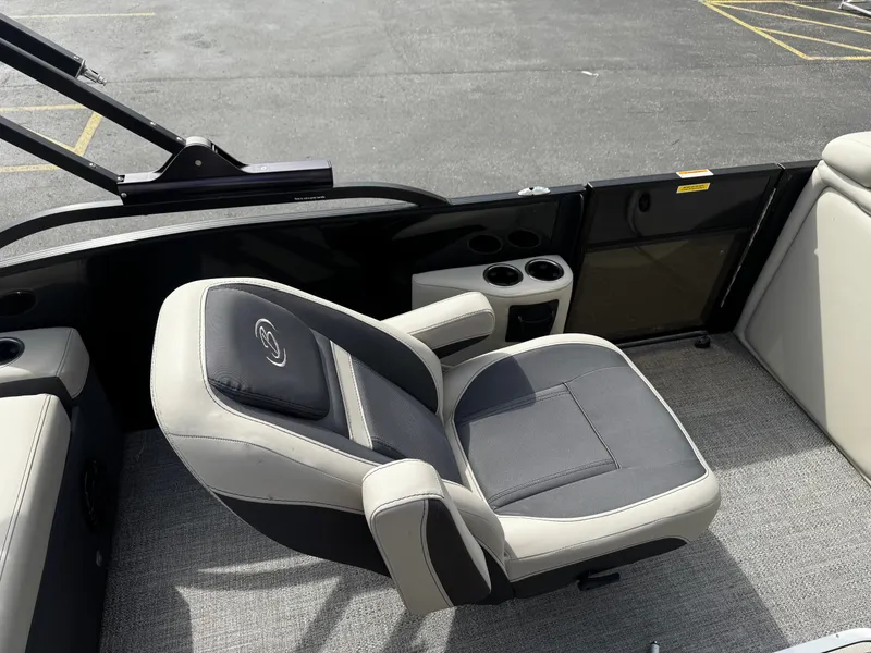 Slide: The Image of Barletta C22UC 2022 boat seat with cup holders on gray carpet. - 14