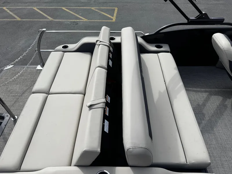 Slide: The Image of Barletta C22UC 2022 boat with beige seating and cup holders. - 16