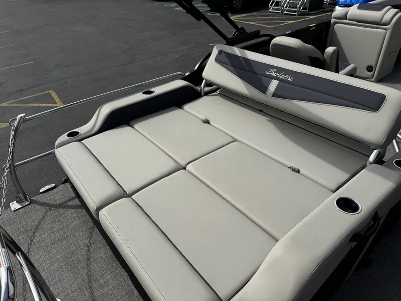 Slide: The Image of 2022 Barletta C22UC pontoon boat with lounge seating and cup holders. - 17