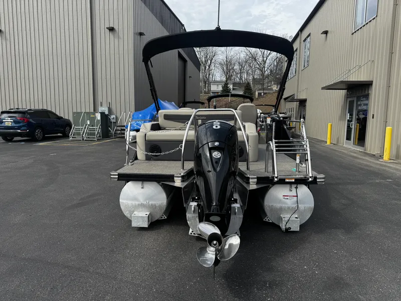 Slide: The Image of 2022 Barletta C22UC pontoon boat with outboard motor in parking lot. - 20
