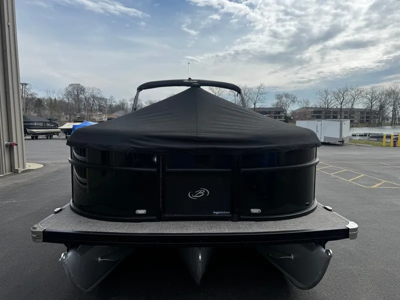 Slide: The Image of 2022 Barletta C22UC pontoon boat with cover outdoors. - 22