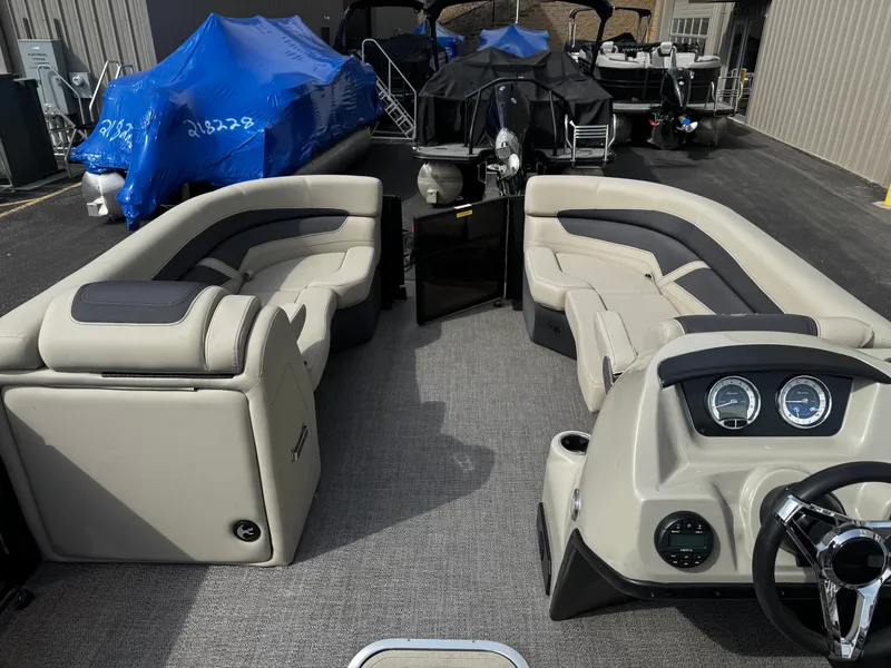 Slide: The Image of Interior of a 2022 Barletta C22UC pontoon boat with gray seating. - 7