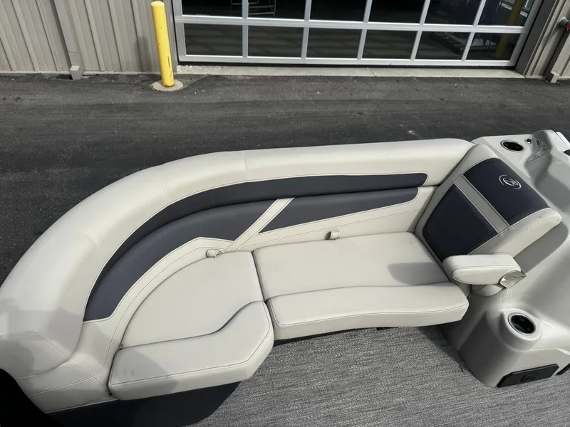 Slide: The Image of 2022 Barletta C22UC pontoon boat seating area in cream and black. - 9