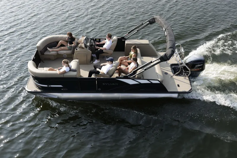 Slide: The Image of Sylvan Mirage 820 CLZ DH 2026 pontoon boat on the water. - 2