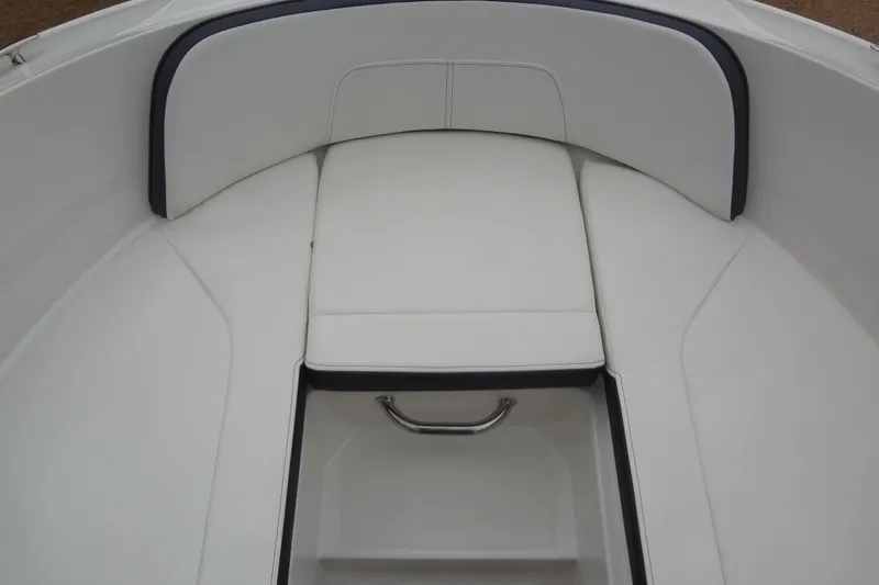 Slide: The Image of Interior seating of 2018 Sea Ray SPX 210 boat, featuring white upholstery. - 11