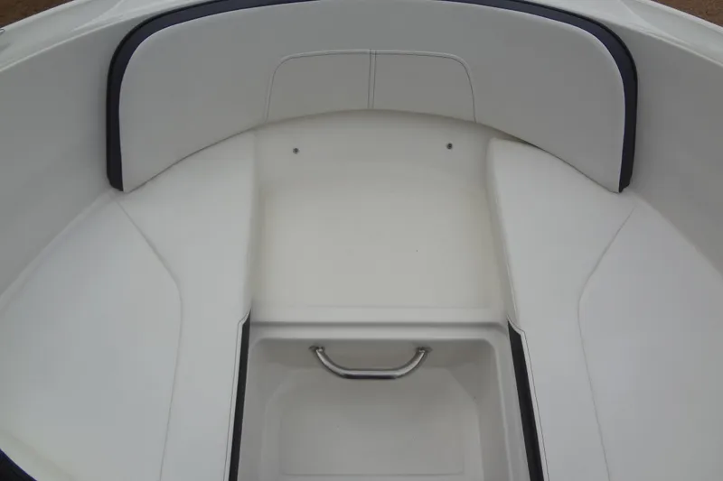 Slide: The Image of Interior view of a 2018 Sea Ray SPX 210 boat's seating area. - 12